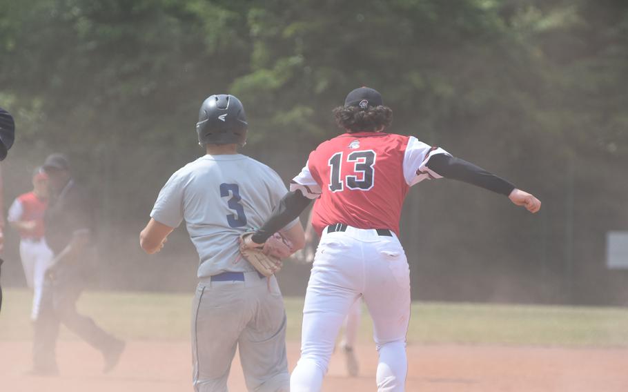 Kaiserslautern's James Leonard tags out Lakenheath's Allen Primmer after a rundown between third and home Wednesday, May 21, 2025, onthe opening day of the DODEA-Eurpe Division I baseball championships at Kaiserslautern, Germany.