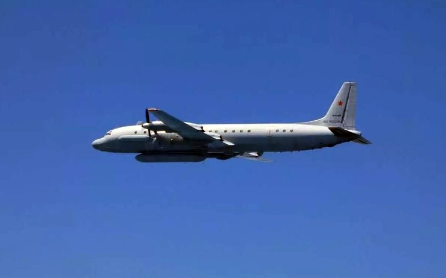 An aircraft flies overhead.