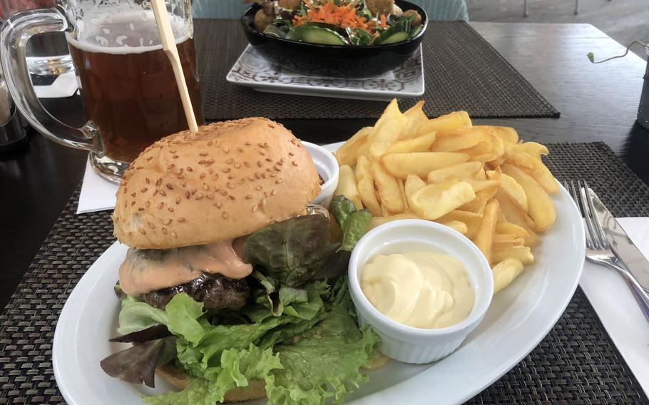 Lumen’s burger made with Angus beef and served with french fries, foreground, and the the vegan falafel bowl. Both were good choices at the restaurant on Wiesbaden’s market square.