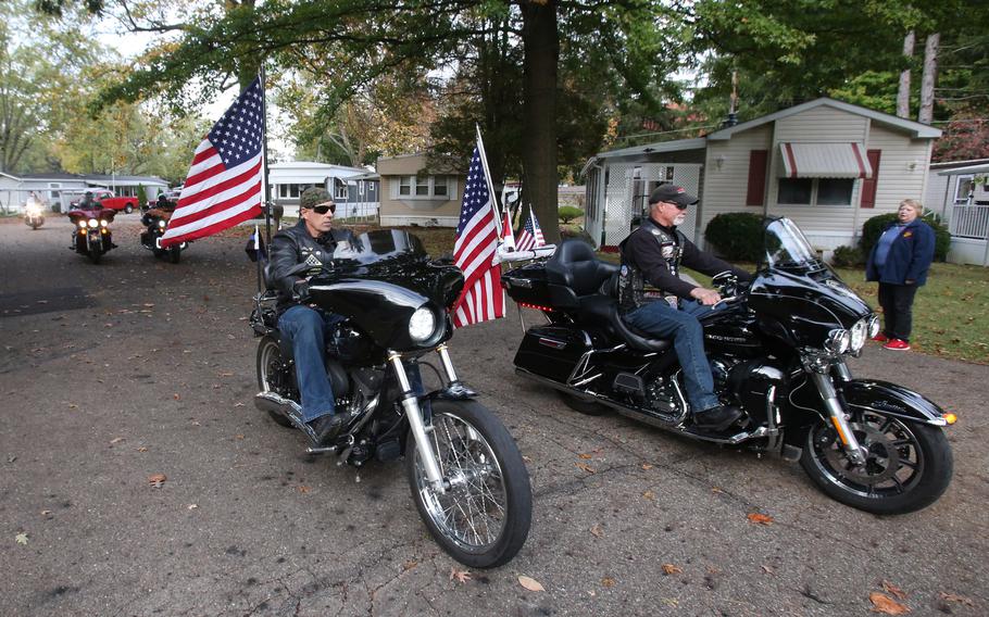 Members of the Patriot Guard arrive with the North Canton home of WWII veteran Denver Conard. 