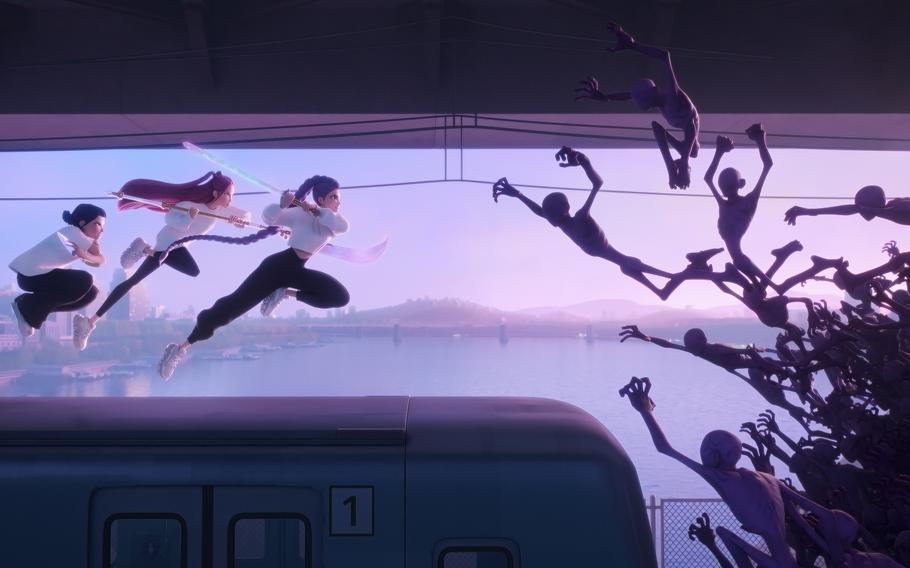  HUNTR/X fights demons in “KPop Demon Hunters.” 