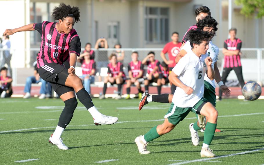 Kadena's Jelani McGhee boots the ball upfield against Kubasaki during Wednesday's DODEA-Okinawa boys soccer match. The Panthers won 8-0.