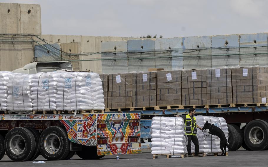 Trucks carrying humanitarian aid for the Gaza Strip pass through the Kerem Shalom Crossing in southern Israel in March.