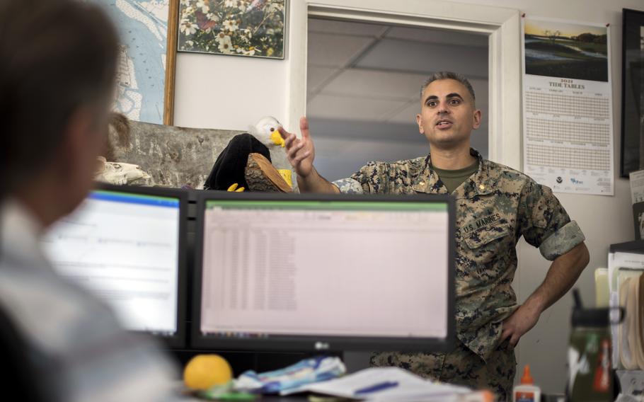 Marine Corps Recruiting Depot Environmental Director Maj. Marc Blair, right, speaks with Director of Natural Resources John Holloway, Jr. in his office, Wednesday, May 11, 2022, in Parris Island, SC