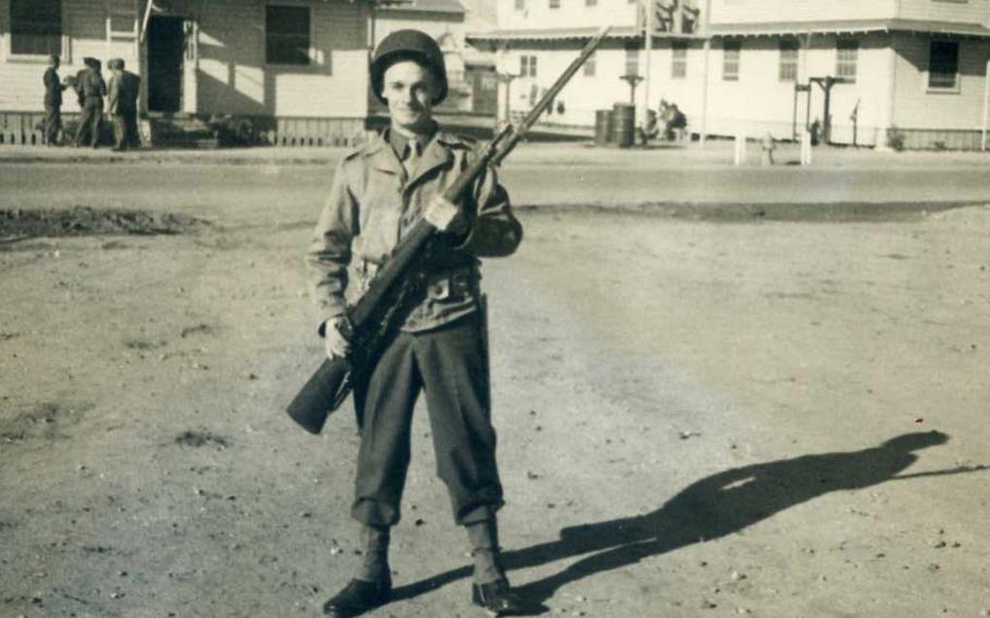 Raleigh Nayes poses with his rifle in this undated photo taken during World War II.