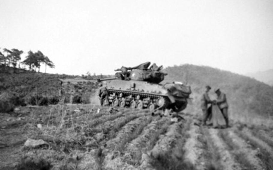An M4 Sherman tank in Kapyong, South Korea,  just hours before the Battle of Kapyong in April 1951. 