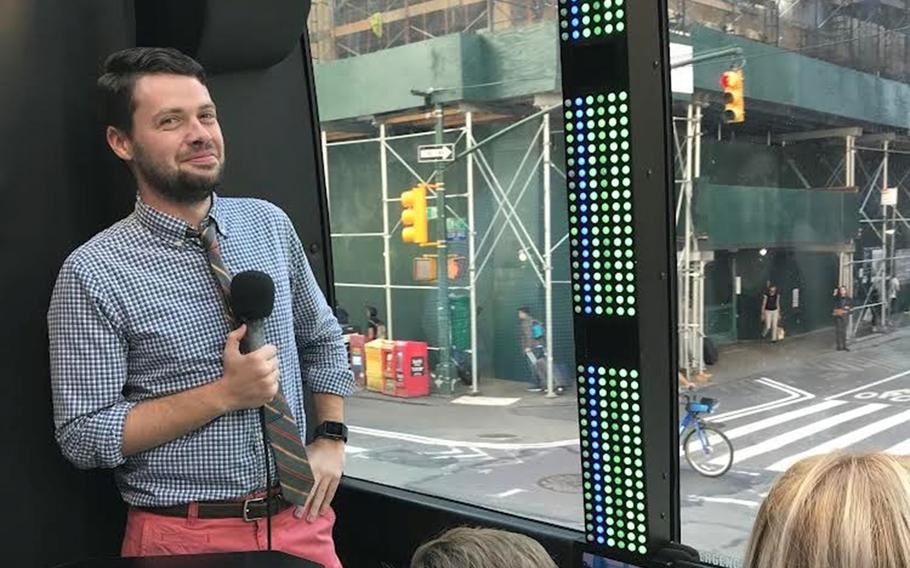 Sean Flanagan works as the host on The Ride, a comedy tour bus in New York City, in July 2022.