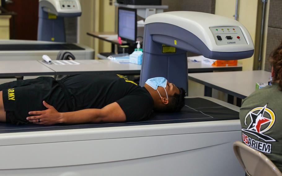 A soldier receives a dual-energy x-ray absorptiometry scan at Fort Bragg, N.C., on Oct. 18, 2021. The scan/study is part of a comprehensive body composition study examining the association between body composition and a soldier’s physical performance and the Army’s efforts to optimize holistic health and fitness and improve soldier readiness.