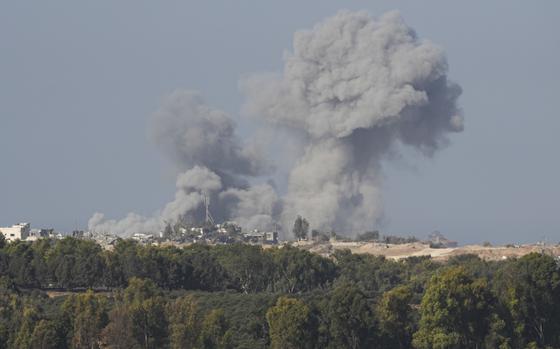 Smoke rises following an Israeli bombardment in the Gaza Strip, as seen from southern Israel on Monday, Dec. 4, 2023. (AP Photo/Ohad Zwigenberg)