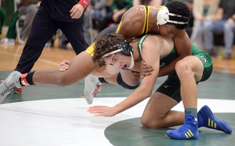 Kadena 160-pounder James Kinney gains the advantage on Kubasaki's Max Lundberg during Wednesday's Okinawa wrestling dual meet. Kinney won by decision 14-6 and the Panthers won the meet 34-28 to go 4-0 over the Dragons on the season.