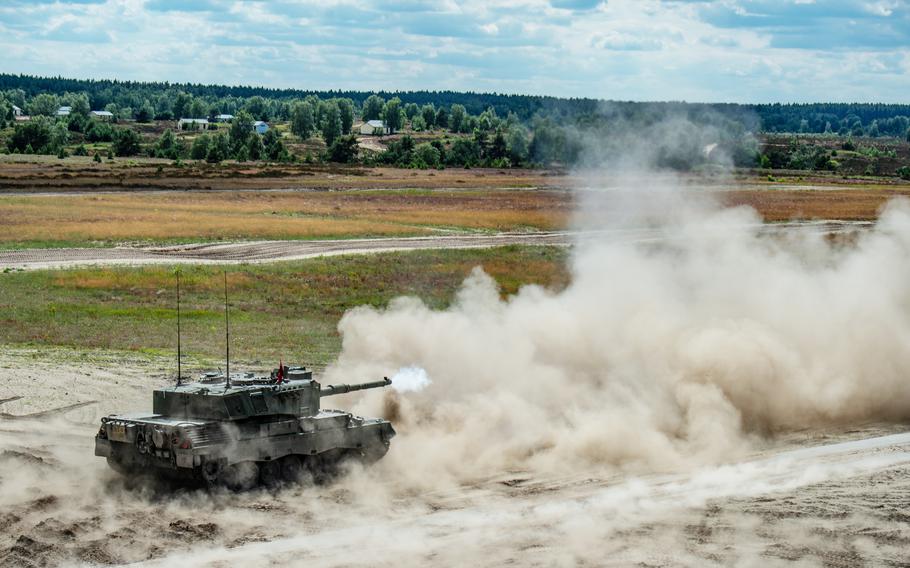 A Leopard 1 A5 tank fires its 105 mm cannon during a live-fire exercise June 13, 2024, at Klietz training range, Germany.