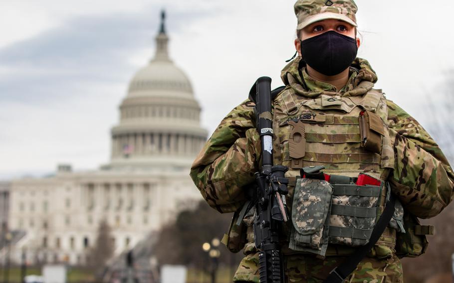 Army Pfc. Teri Oglesby of the Indiana National Guard provides security near the U.S. Capitol in Washington, March 1, 2021. The Guard could be forced to ground aircraft, cut back on training and curtail maintenance if it is not reimbursed by Aug. 1 for its mission to the Capitol,  the National Guard Association of the United States advocacy group said Wednesday, June 16, 2021.