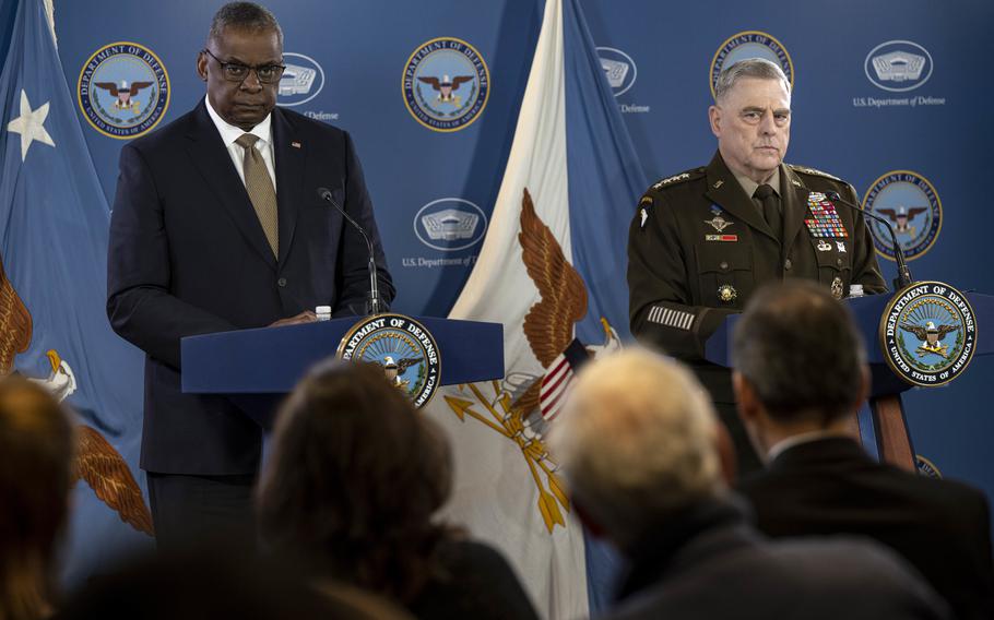 Secretary of Defense Lloyd Austin, left, accompanied by Chairman of the Joint Chiefs, Gen. Mark Milley, speaks during a briefing at the Pentagon in Washington, Wednesday, March 15, 2023. 
