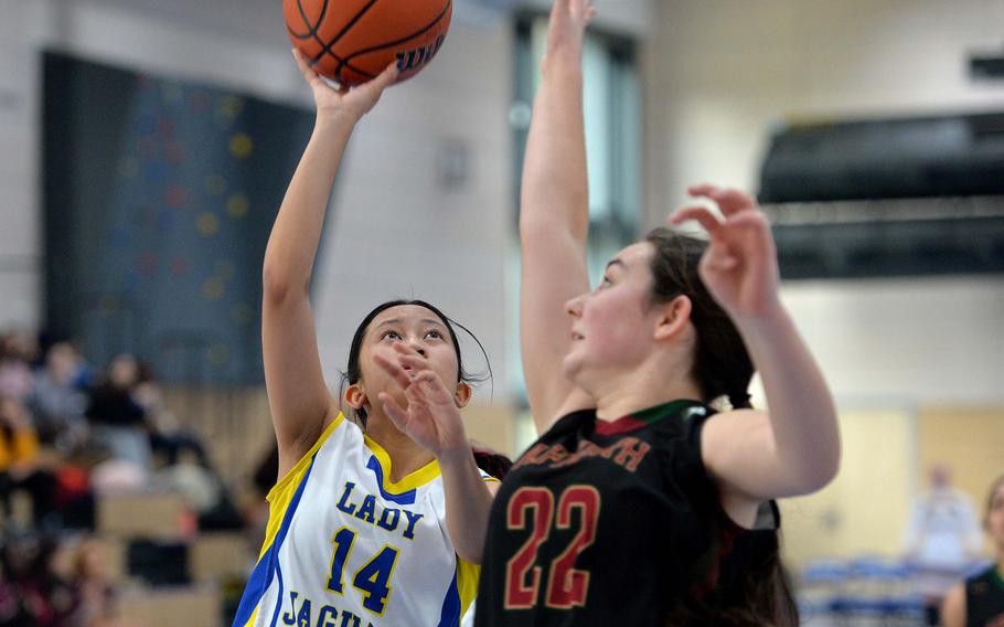 Sigonella’s Alexandria Alonso shoots over AFNORTH’s Paula Bohlen in the Division III championship game at the DODEA-Europe basketball finals in Ramstein, Germany, Feb. 18, 2023. Sigonella took the division title with a 36-25 win.