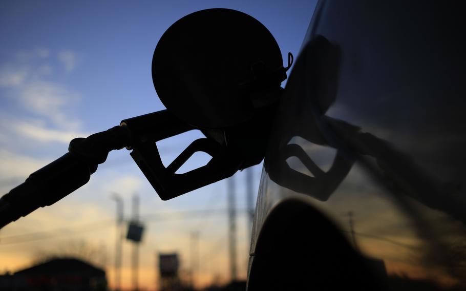 A fuel pump in a vehicle at a BP gas station in Louisville, Ky., on Jan. 29, 2021. Retail prices have now fallen for 21 consecutive days, the longest losing streak since April 2020. 