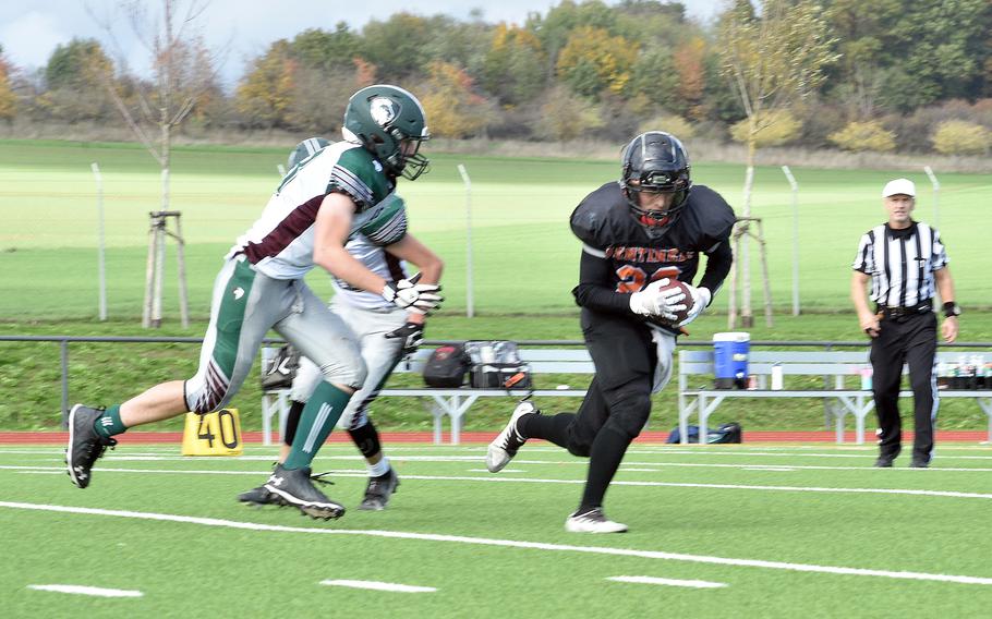 Spangdahlem’s Casey Supringer intercepts a pass intended for AFNORTH’s Caden Snider during the second quarter of a DODEA-Europe Division III semifinal in Spangdahlem, Germany. 
