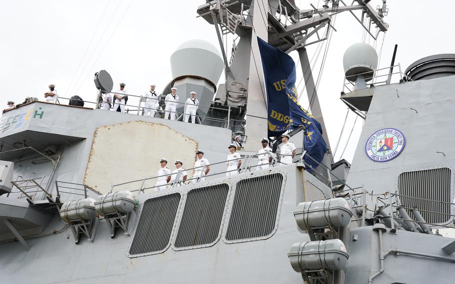 Sailors man the rails of the Arleigh Burke class guided-missile destroyer USS Mitscher (DDG 57) as the ship returns to Naval Station Norfolk on Sept. 17, 2021, to end a nine-month deployment. 