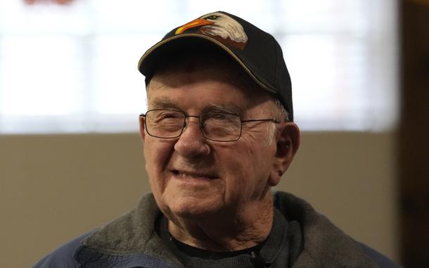 Earl Meyer talks with fellow veterans at the American Legion in St. Peter, Minn., in November 2023.