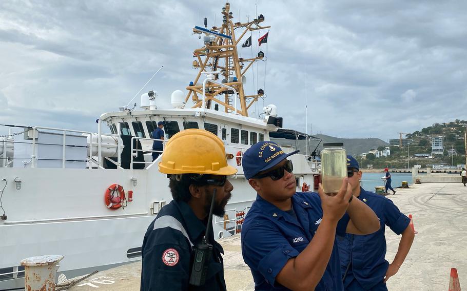 A machinery technician from Coast Guard Quick Response Cutter Oliver Henry performs a fuel test after the boat arrived in Port Moresby, Papua New Guinea, August 23, 2022.