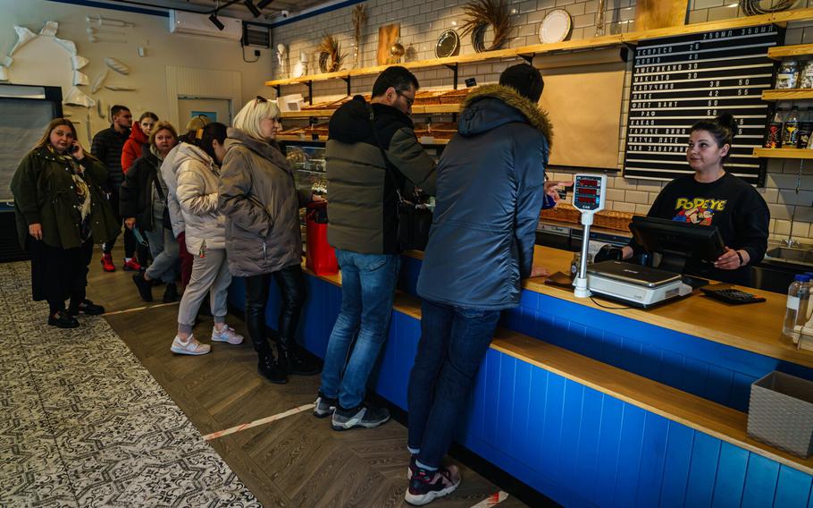 Customers line up for pastries at Khlibar, a bakery in Kyiv, Ukraine, Tuesday, March 15, 2022.