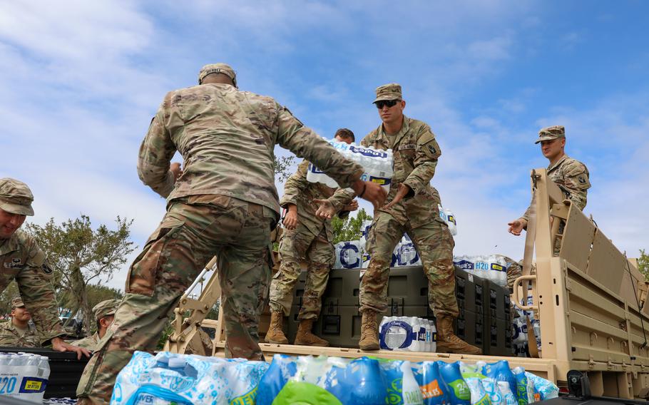 Soldiers with the Florida National Guard's Chemical, Biological, Radiological/Nuclear, and Explosive (CBRNE)-Enhanced Response Force Package (FL-CERFP) load supplies during Hurricane Ian, Sarasota, Fla., Sept. 29, 2022. 