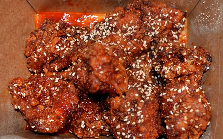 Chicken Kokio’s red chicken has a sweet and spicy chili sauce with sesame seeds sprinkled across the top, May 16, 2021 in Mainz, Germany.