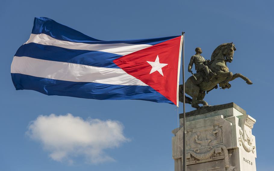 Cuba’s flag flies next to a monument to national hero Antonio Maceo in Havana, Cuba. 