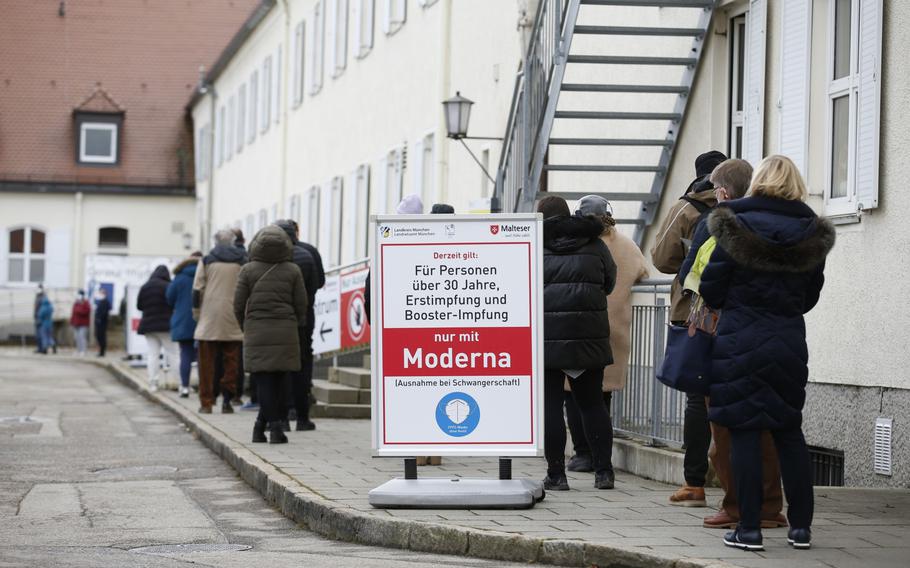 Visitors wait to receive COVID-19 vaccines at a vaccine center in Munich on Dec. 2, 2021. 