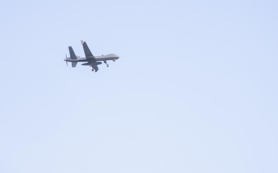 An MQ-9 Reaper flies overhead during an amphibious raid for a multinational littoral operations exercise as part of Rim of the Pacific (RIMPAC) 2022 at Pyramid Rock Beach, Marine Corps Base Hawaii, July 30, 2022. Marines in Kaneohe are now officially cleared to operate their new drones as the service reorganizes its forces for Pacific operations.