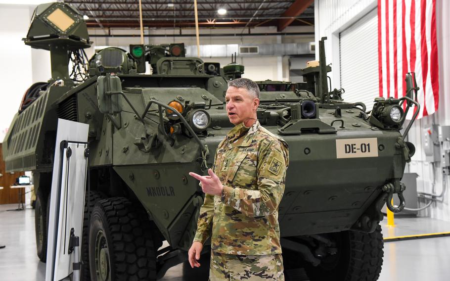 Gen. Joseph Martin, the vice chief of the Army, speaks at Kord Technologies headquarters in Huntsville, Ala., where the company is working with the Army’s Rapid Capabilities and Critical Technologies Office, or RCCTO, at nearby Redstone Arsenal to develop a new laser weapon. The first prototype of that weapons, the Directed Energy Maneuver Short-Range Air Defense system, or DE M-SHORAD, is pictured behind Martin, who visited April 29. 