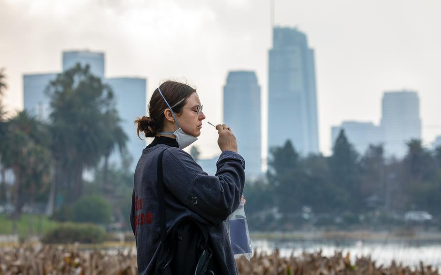 Lyndsey Marko takes a free PCR COVID-19 test at Echo Park on Jan. 18, 2022, in Los Angeles, California. 