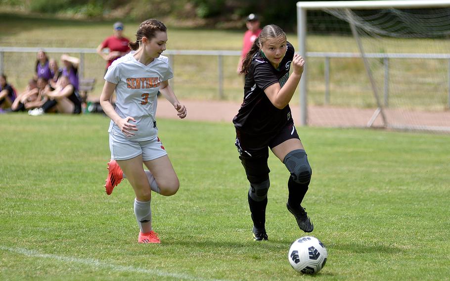 AFNORTH sophomore Emery Koger dribbles toward the goal as Spangdahlem defender Lena Maassen tries to keep up during the second day of round-robin action at the 2025 Division III DODEA European championships on May 20, 2025, at Rothenborn Stadion in Landstuhl, Germany. The Lions defeated Ansbach 3-1 on Wednesday to advance to Thursday’s title match at Ramstein High School.
