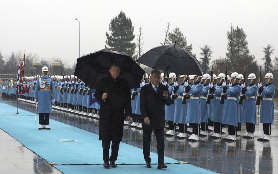 Turkish President Recep Tayyip Erdogan, left, and Finland’s President Sauli Niinisto inspect a military honor guard during a welcome ceremony at the presidential palace in Ankara, Turkey, Friday, March 17, 2023. Erdogan greeted his Finnish counterpart in Ankara on Friday amid hopes that their meeting will see Turkey approve Finland’s NATO membership bid. 