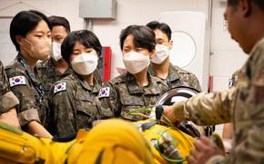 South Korean army officers wear masks while taking an immersion tour of Osan Air Base, South Korea, Aug. 2, 2022.