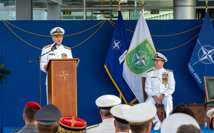 At a change of command ceremony for Allied Joint Forces Command Naples, Adm. Robert P. Burke, standing, hands over authority to Adm. Stuart B. Munsch at JFC Naples, Italy, June 27, 2022. 