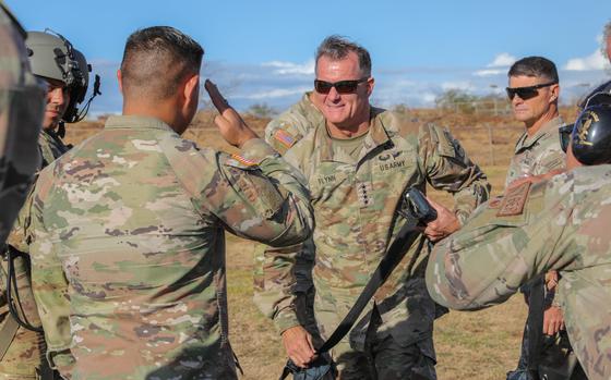 Army Gen. Charles Flynn, commanding general of the U.S. Army Pacific, receives a salute from troops at the Hawaii Army National Guard Puunene Armory, Maui, Aug. 15, 2023.