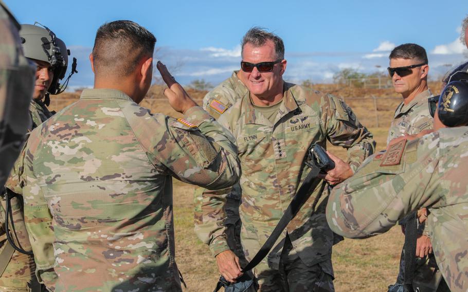 Army Gen. Charles Flynn, commanding general of the U.S. Army Pacific, receives a salute from troops at the Hawaii Army National Guard Puunene Armory, Maui, Aug. 15, 2023.