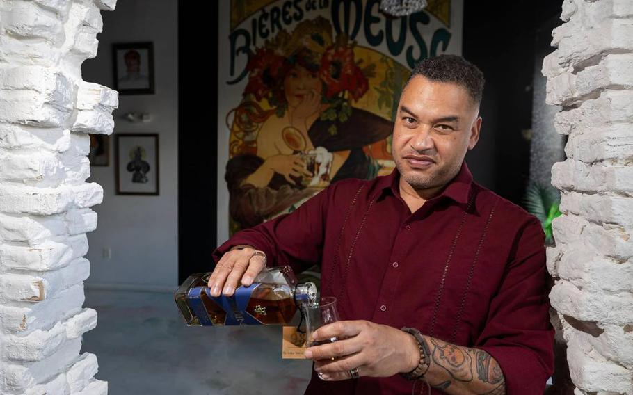 Retired U.S. Marine Major Eric Dominijanni is photographed pouring his FIOR Scotch 