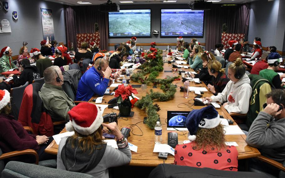 The NORAD Tracks Santa Operation Center on Peterson Air Force Base, Colo., Dec. 24, 2019, the last Christmas before the coronavirus pandemic. NORAD has been tracking Santa since 1955, when a young child dialed the unlisted phone number of the Continental Air Defense Command Operations Center, believing she was calling Santa Claus after seeing a promotion in a local newspaper. 