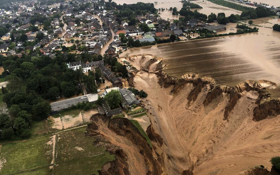 This image provided on Friday, July 16, 2021 by the Cologne district government shows the Blessem district of Erftstadt in Germany. Rescuers were rushing Friday to help people trapped in their homes in the town of Erftstadt.