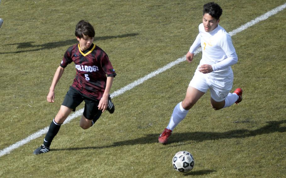 Marist's Giuliano Tempesta and Yokota's Luke Harbert chase the ball during Saturday's Perry Cup semifinal, won by the Bulldogs 1-0.