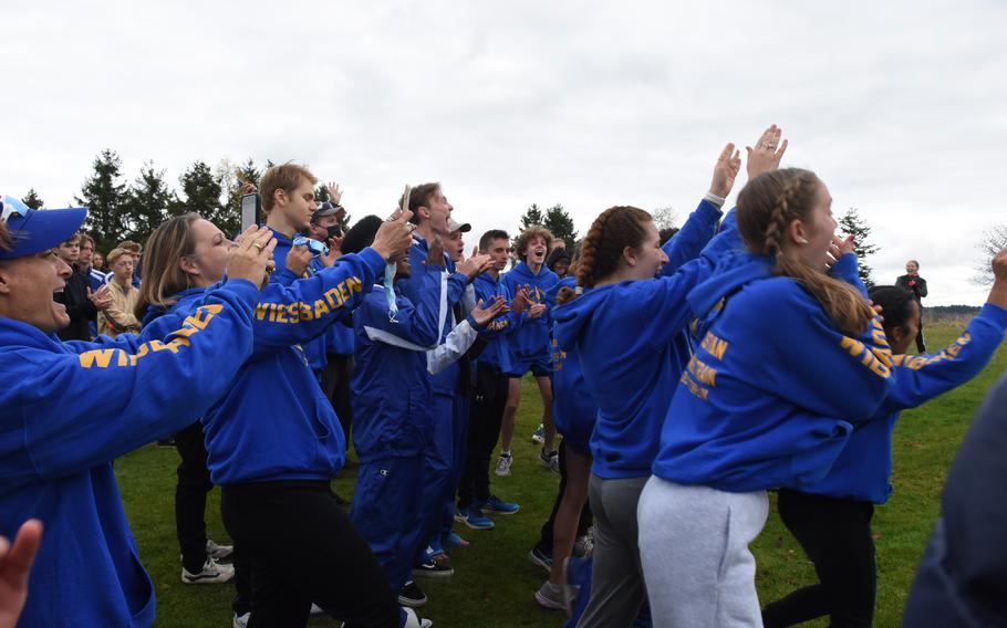 Wiesbaden celebrates its unexpected team win in the girls’ large-school division at the DODEA-Europe cross country championships on Saturday, Oct. 23, 2021, in Baumholder, Germany. Wiesbaden beat Ramstein by four points for the title.