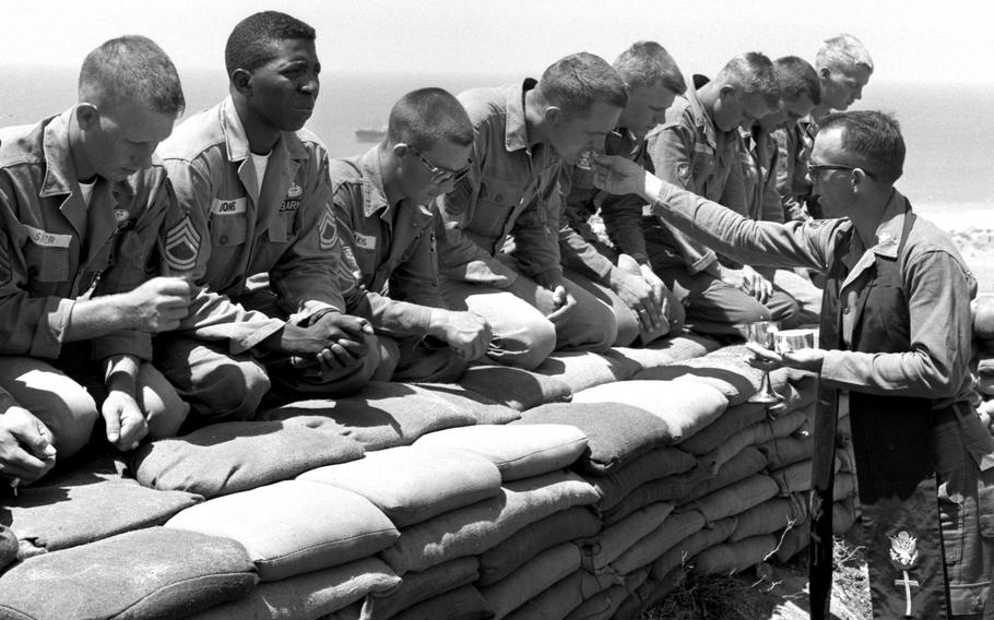 On a hilltop overlooking the Mediterranean near Beirut, Chaplain (Capt.) James Coleman conducts a religious service for soldiers from the 24th Infantry Division. The troops were taking part in Operation Blue Bat, an intervention aimed at protecting the beleaguered Lebanese government.