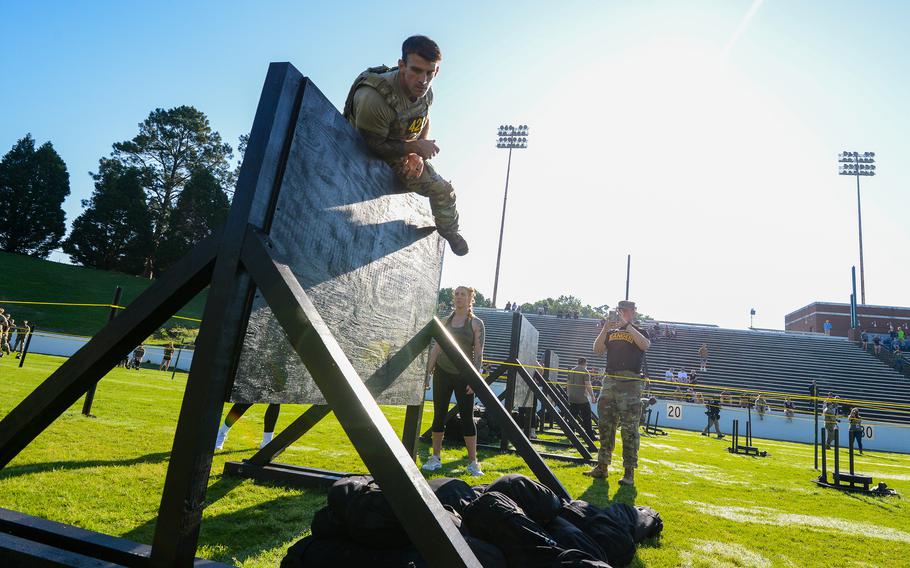 A soldier scales a 6-foot wall during the second day of the Best Ranger Competition, Saturday, April 15, 2023 at A.J. McClung Memorial Stadium in Columbus, Ga. 