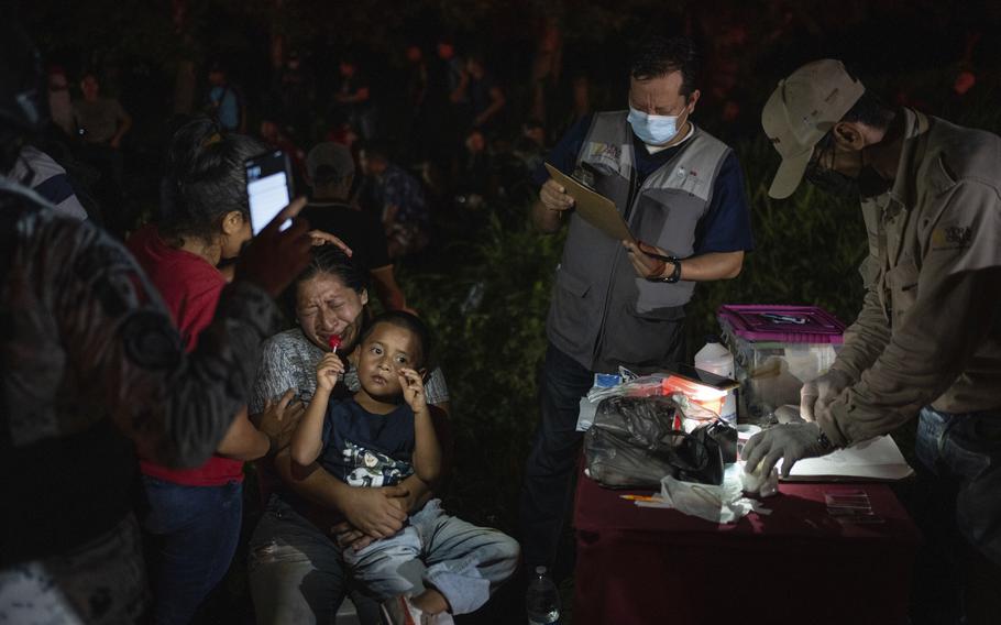 Migrants, mainly from Central America, who were traveling to the U.S. inside a tractor-trailer, are detained by Mexican immigration agents and National Guard members, in Veracruz, Mexico, Sunday, July 23, 2023. The image was part of a series by Associated Press photographers Ivan Valencia, Eduardo Verdugo, Felix Marquez, Marco Ugarte Fernando Llano, Eric Gay, Gregory Bull and Christian Chavez that won the 2024 Pulitzer Prize for feature photography.