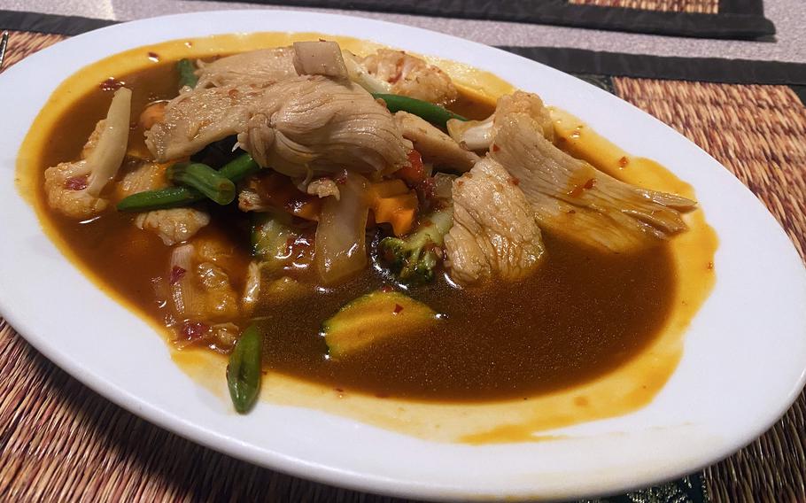 Chicken and vegetables with pad prik sauce at the Sai Nam Thai restaurant in Freihung, Germany, Dec. 6, 2022. Spicy dishes can be ordered with different levels of heat. 