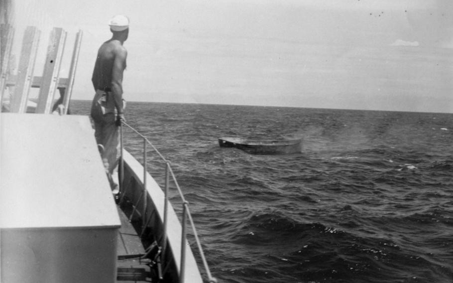 All of the survivors from the attack on the Bloody Marsh were rescued later in the morning by the Submarine Chaser (SC) 1049A. Here a crew member watches one of the lifeboats. 