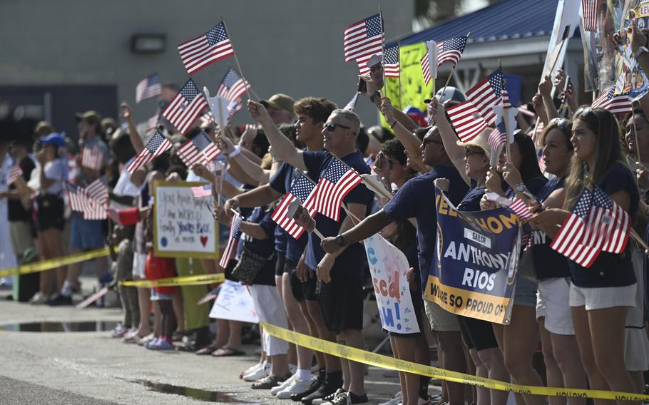 Families wait pierside as Arleigh-Burke class guided-missile destroyer USS Carney returns home Sunday, May 19, 2024, to Naval Station Mayport, Fla. 