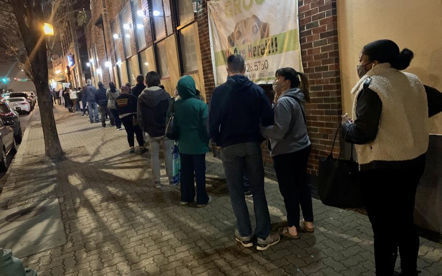A line of people stretches for an entire block on Georgia Avenue in Silver Spring, Md., for COVID testing on Saturday.