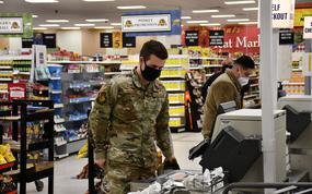 Airmen shop at the commissary at RAF Lakenheath, England, Nov. 30, 2021. Masks are still mandatory at U.S. commissaries in England while the country-wide mask mandate in the country is slated to end Jan. 27. 